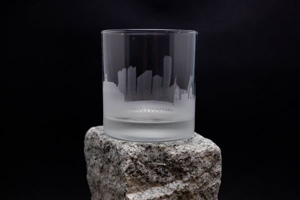 a glass sitting on top of a rock
