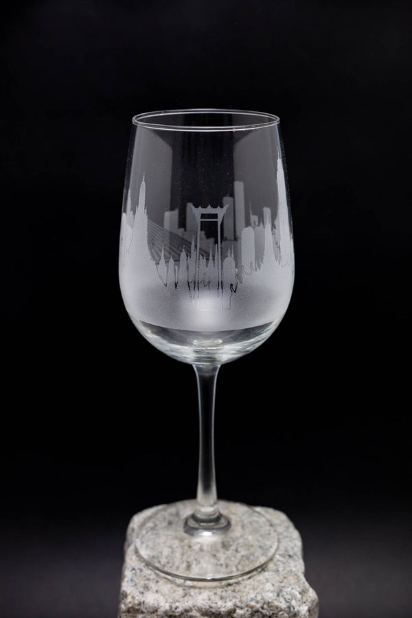 a wine glass sitting on top of a rock