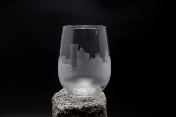 a glass sitting on top of a rock