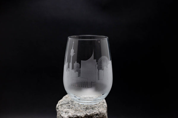 a glass sitting on top of a rock