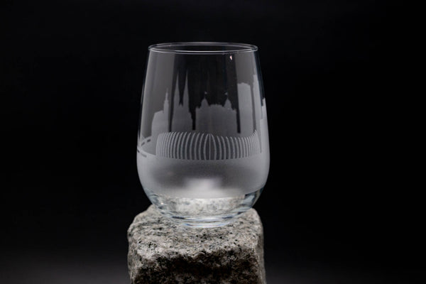 a glass sitting on top of a rock