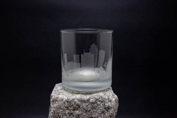 a glass sitting on top of a rock