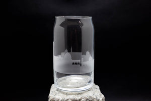 a glass on a rock on a black background