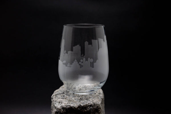 a glass sitting on top of a rock