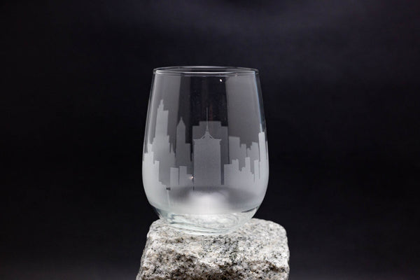 a glass sitting on top of a rock