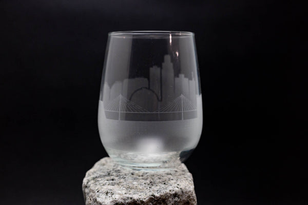a glass sitting on top of a rock