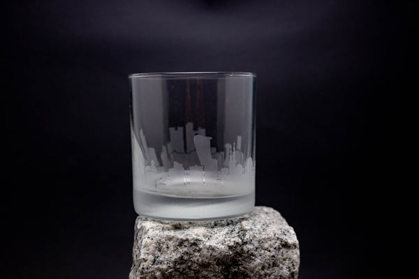 a glass sitting on top of a rock