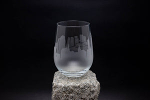 a glass sitting on top of a rock