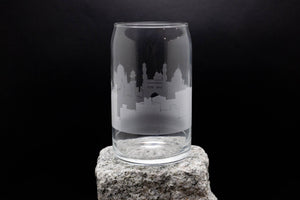 a glass sitting on top of a rock