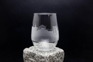 a glass sitting on top of a rock