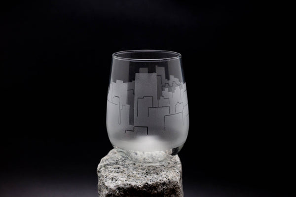 a glass sitting on top of a rock