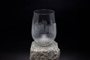 a glass sitting on top of a rock