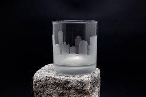 a glass sitting on top of a rock