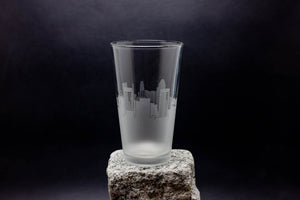 a glass sitting on top of a rock