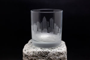 a glass sitting on top of a rock