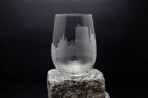 a glass sitting on top of a rock