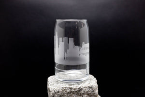 a glass sitting on top of a rock