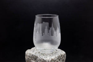 a glass sitting on top of a rock