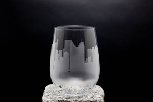 a glass sitting on top of a rock