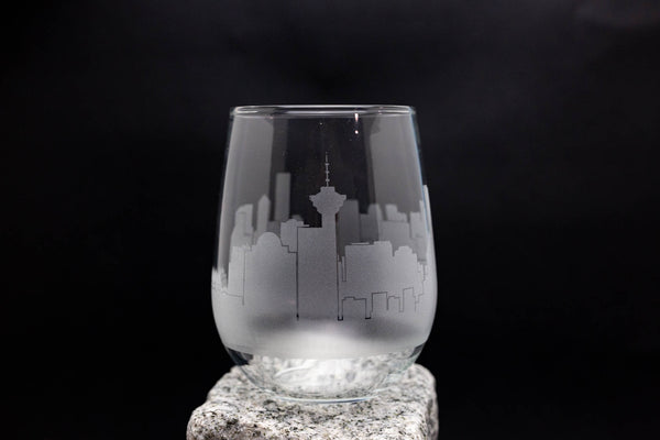 a glass sitting on top of a rock