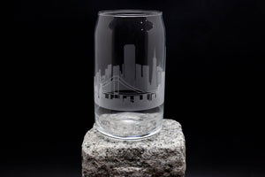 a shot glass sitting on top of a rock