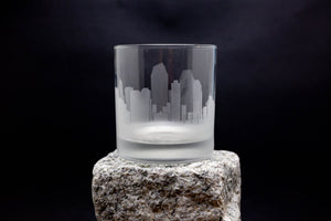 a glass sitting on top of a rock