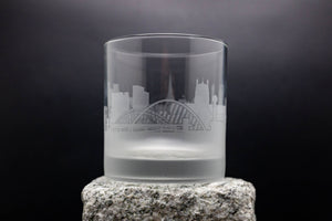 a shot glass sitting on top of a rock