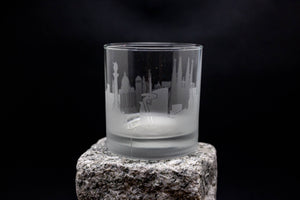 a glass sitting on top of a rock