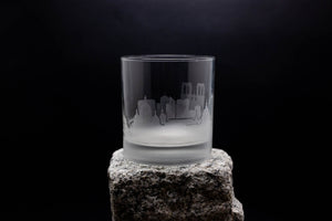 a glass sitting on top of a rock