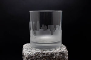 a glass sitting on top of a rock