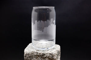 a glass sitting on top of a rock