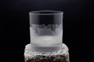 a glass sitting on top of a rock