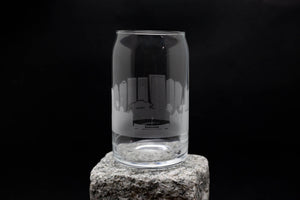 a clear glass sitting on top of a rock