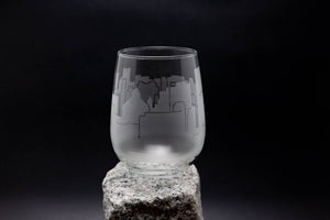 a glass sitting on top of a rock