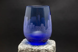 a blue glass sitting on top of a rock