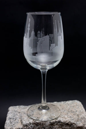 a wine glass sitting on top of a rock