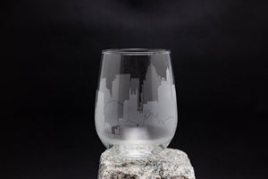 a glass sitting on top of a rock