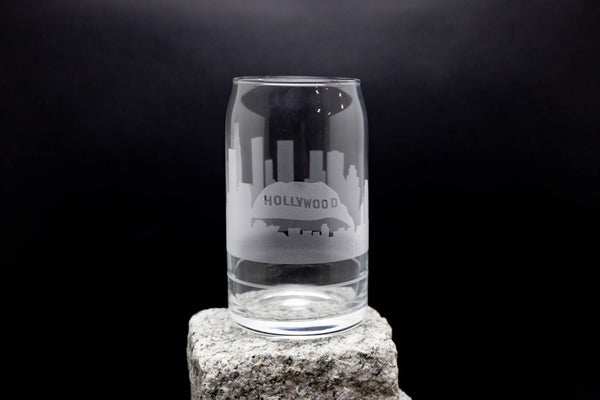 a clear glass sitting on top of a rock