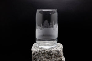 a glass sitting on top of a rock