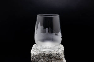 a glass sitting on top of a rock