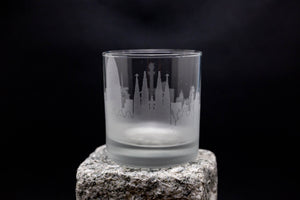 a shot glass sitting on top of a rock