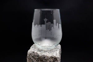 a glass sitting on top of a rock