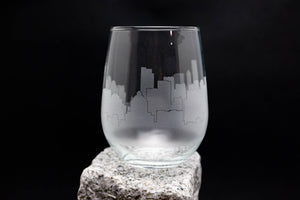 a glass sitting on top of a rock