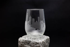 a glass sitting on top of a rock