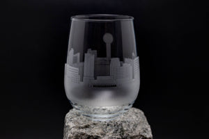 a glass sitting on top of a rock