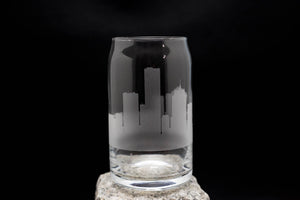 a clear glass with a black skyline on it