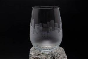 a glass sitting on top of a rock