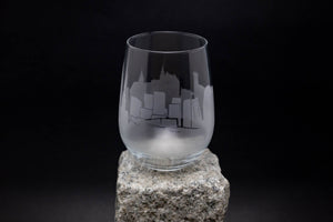 a glass sitting on top of a rock