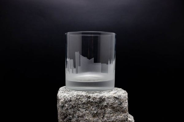 a glass sitting on top of a rock