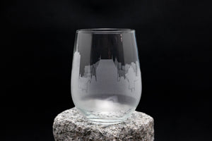 a glass sitting on top of a rock